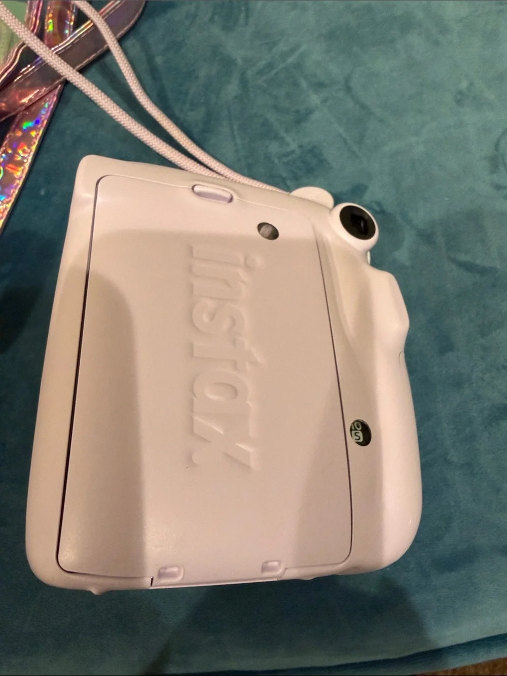 Fujifilm instax mini 11 camera with stylish metallic cross body bag.